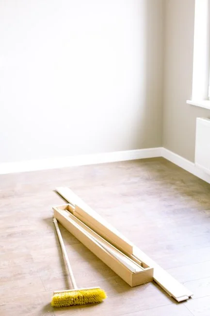 Happy couple setting up a sofa in their new home surrounded by moving boxes.